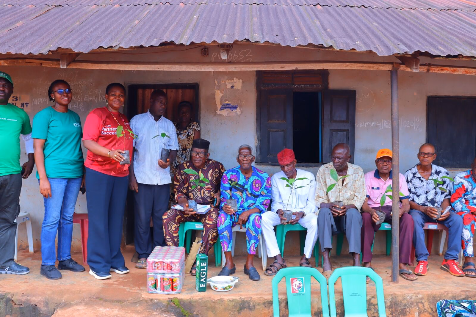 Teasoo team distributing seedlings to community elders